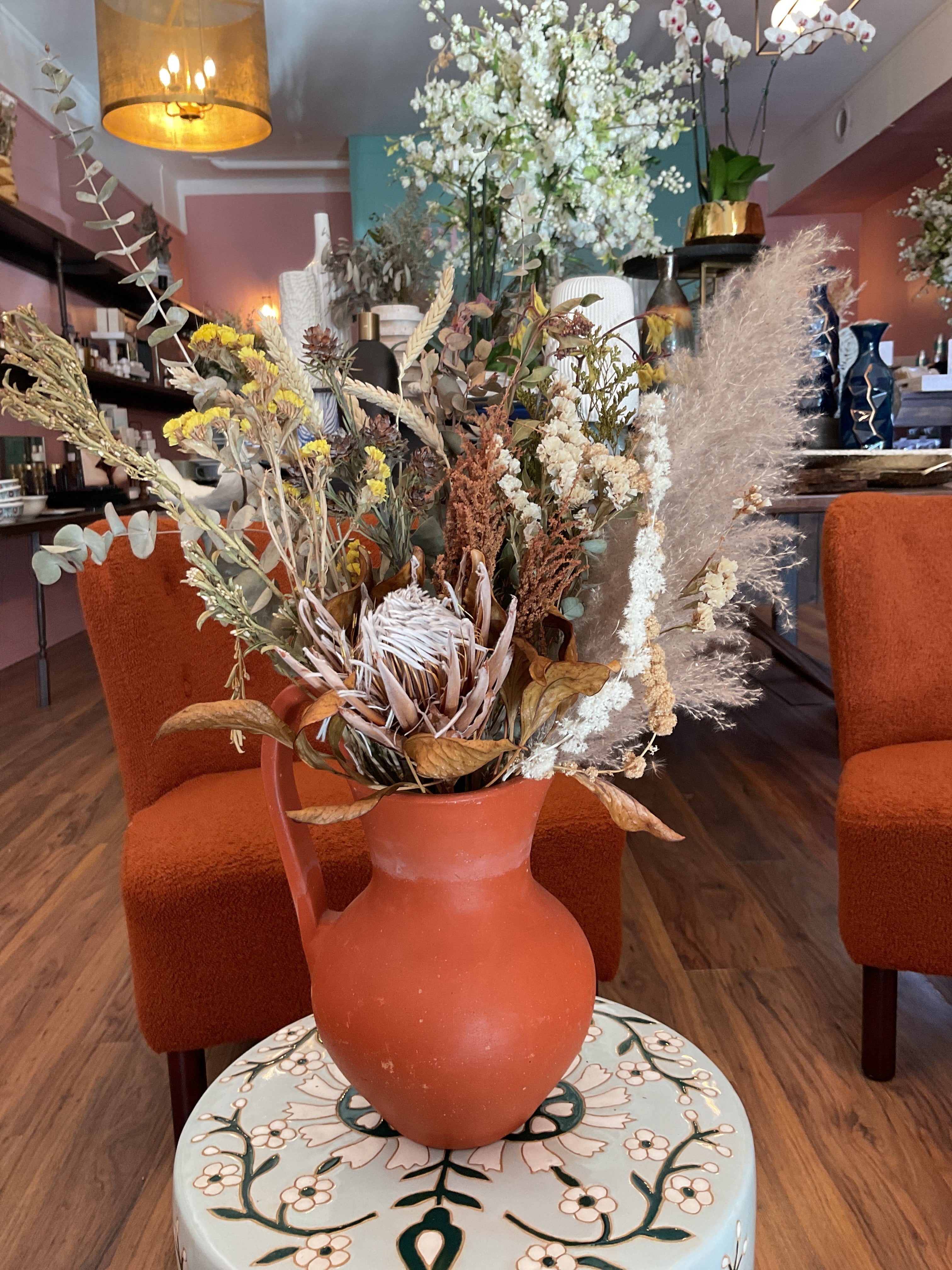 Dried Flowers in Orange Vase