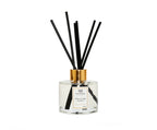 Clear Bottle Diffuser with White and Pink Flowers