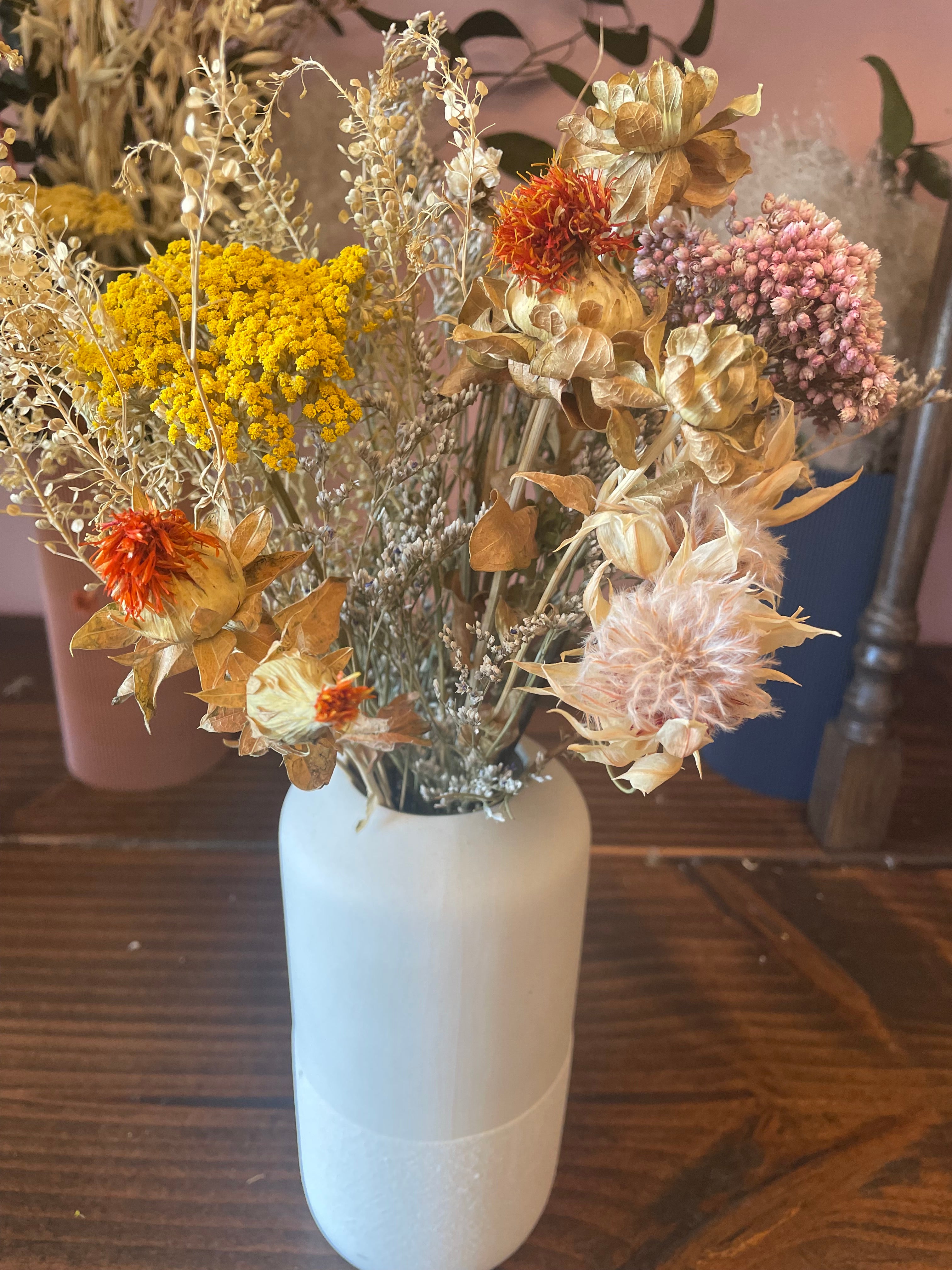 Dried flowers in white vase