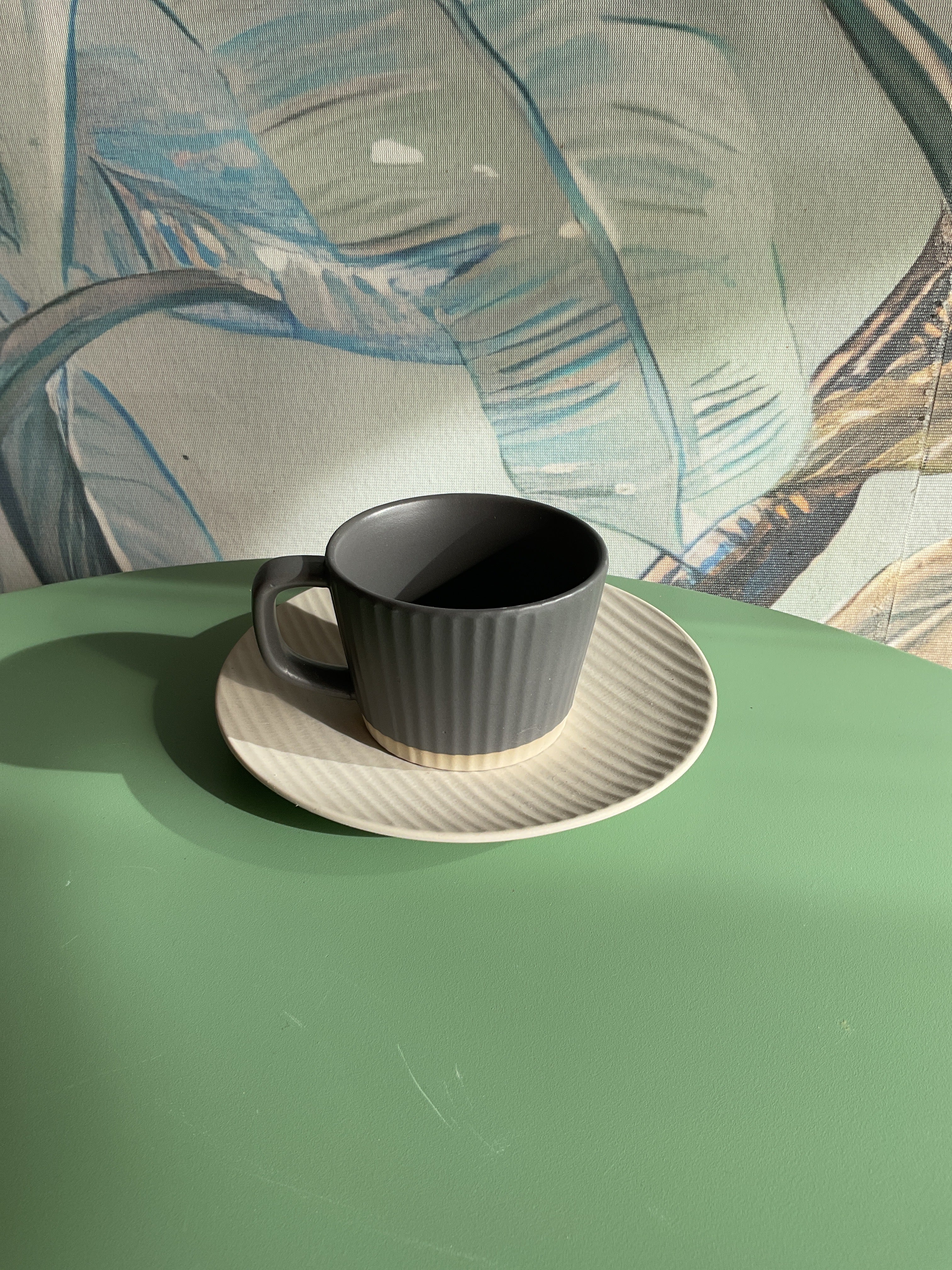 Gray and Beige Cup and Saucer