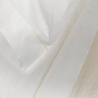 Close-up of organic cotton sheet from the Serene Sheet Set by Rest & Reset, highlighting softness and drape