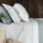 Serene Sheet Set by Rest & Reset styled on a bed, highlighting smooth organic cotton and relaxed comfort