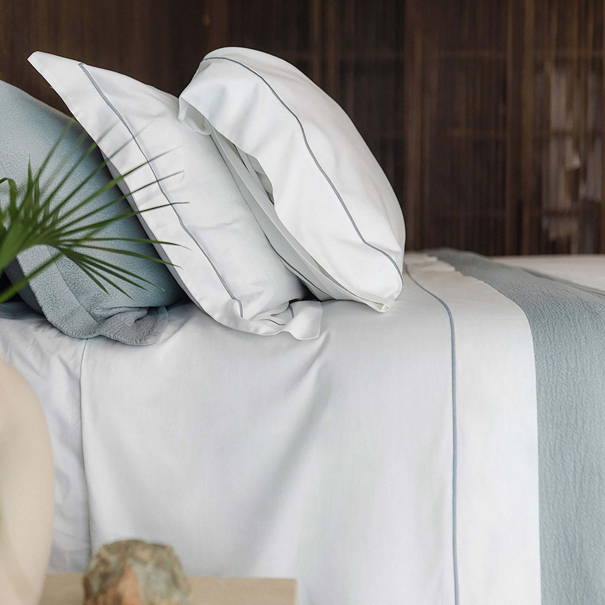 Serene Sheet Set by Rest & Reset styled on a bed, highlighting smooth organic cotton and relaxed comfort