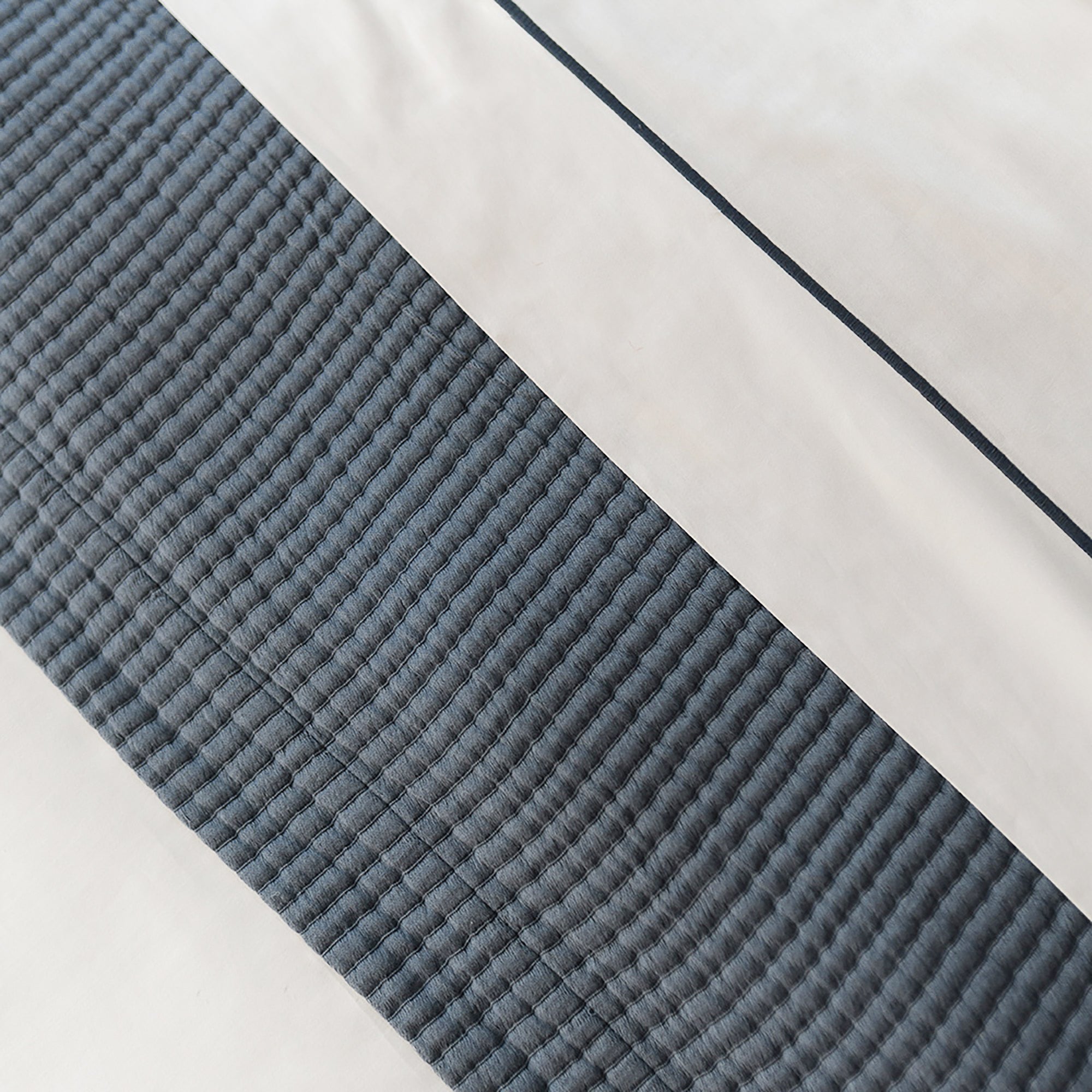 Close-up of organic cotton fabric from the Serene Sheet Set by Rest & Reset, highlighting subtle texture and depth