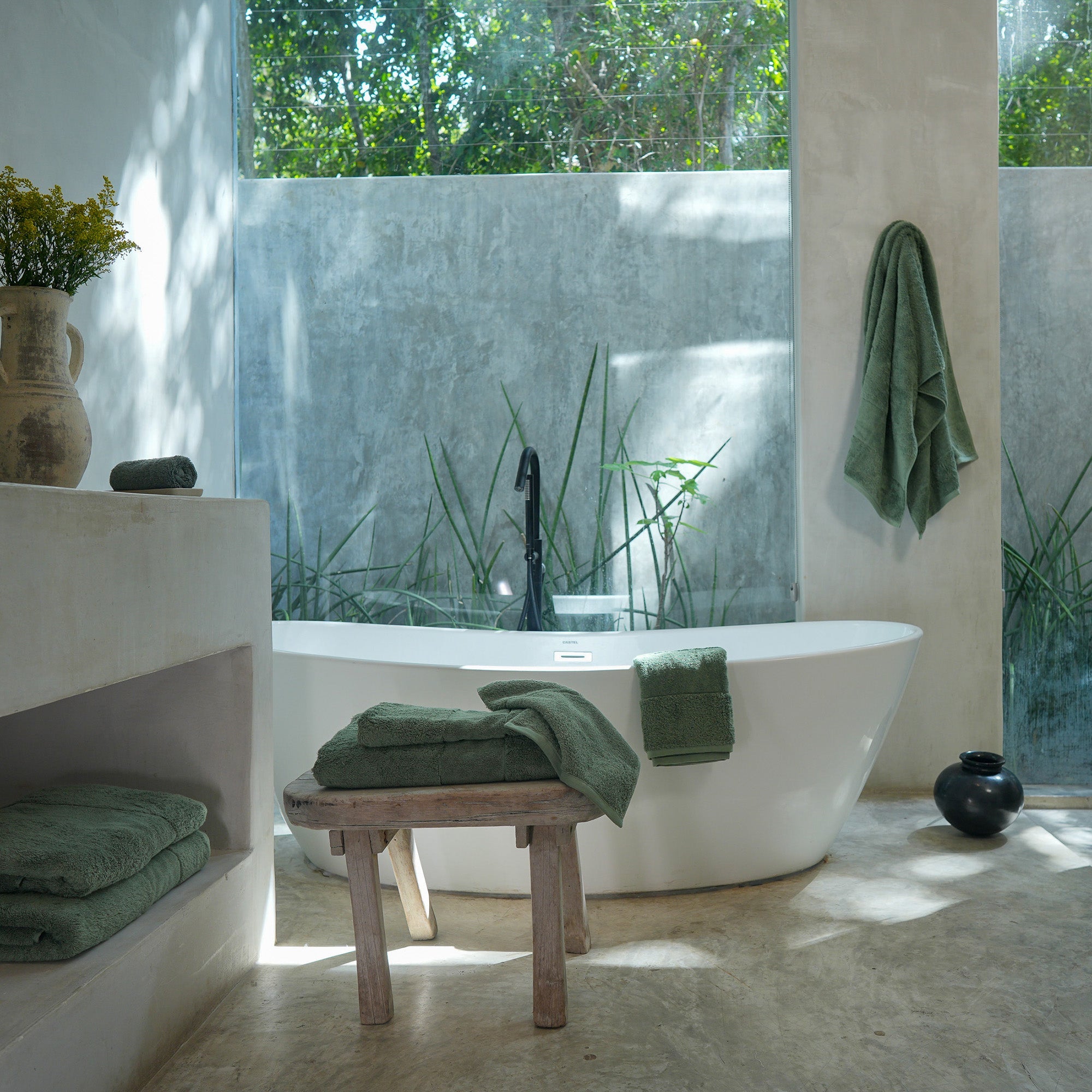 Ritual Bath Towel Set by Rest & Reset styled as part of a complete bathroom setting for spa-inspired living