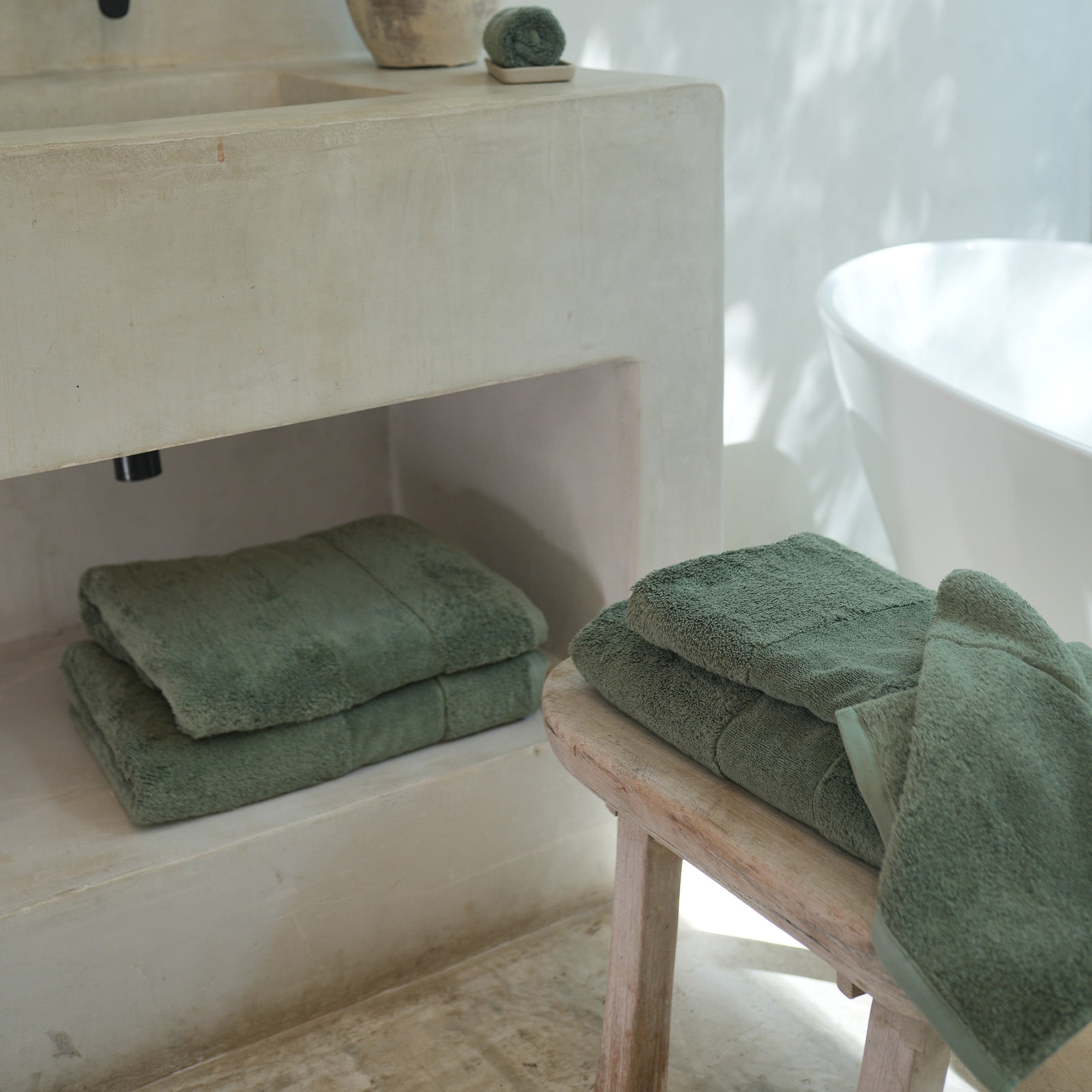 Ritual Bath Towel Set by Rest & Reset styled near the shower, supporting absorbency and daily wellness routines