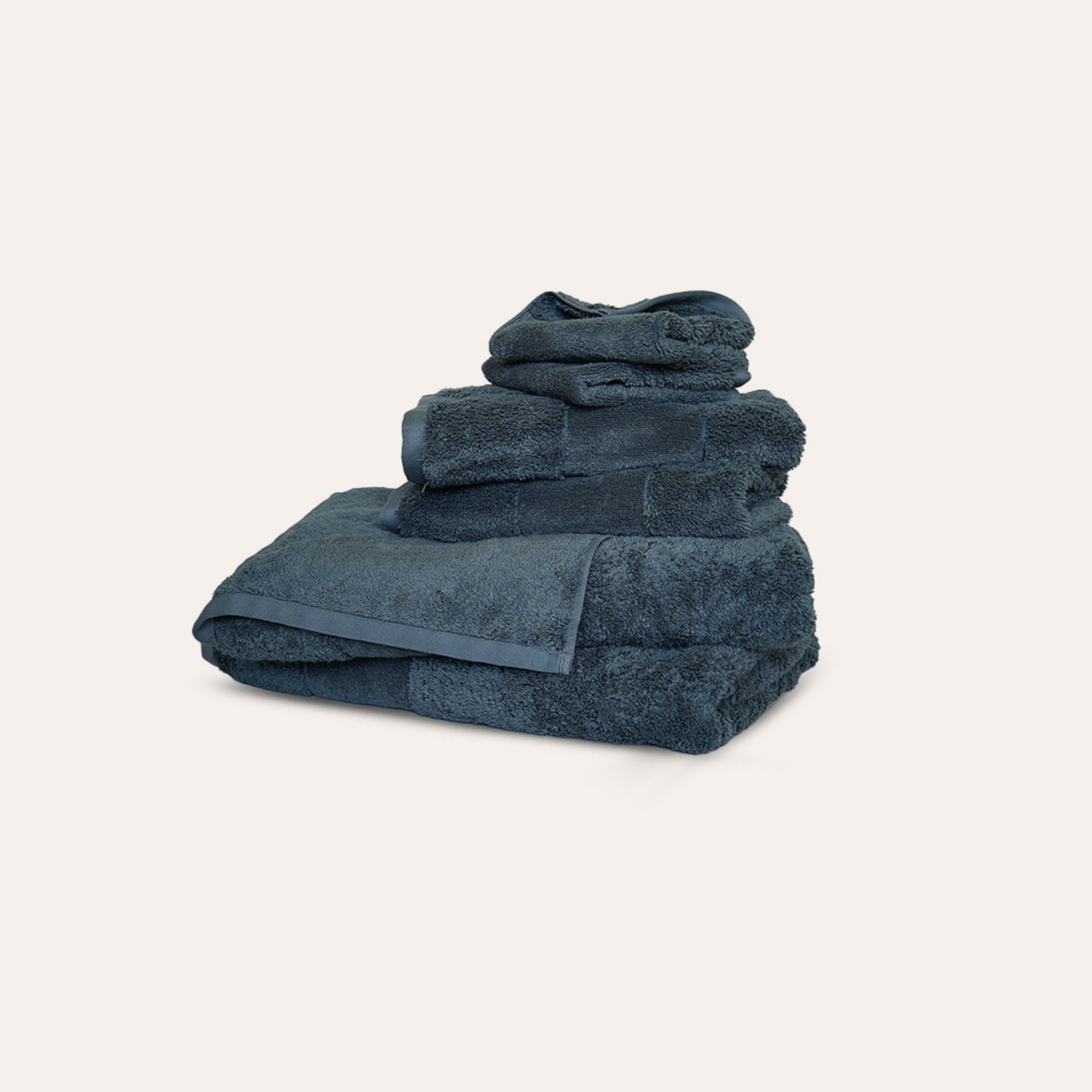 Ritual Bath Towel Set by Rest & Reset folded in a darker tone, highlighting plush organic cotton fabric