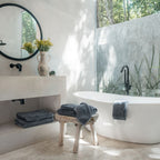 Ritual Bath Towel Set by Rest & Reset styled in a minimalist bathroom, emphasizing simplicity and comfort
