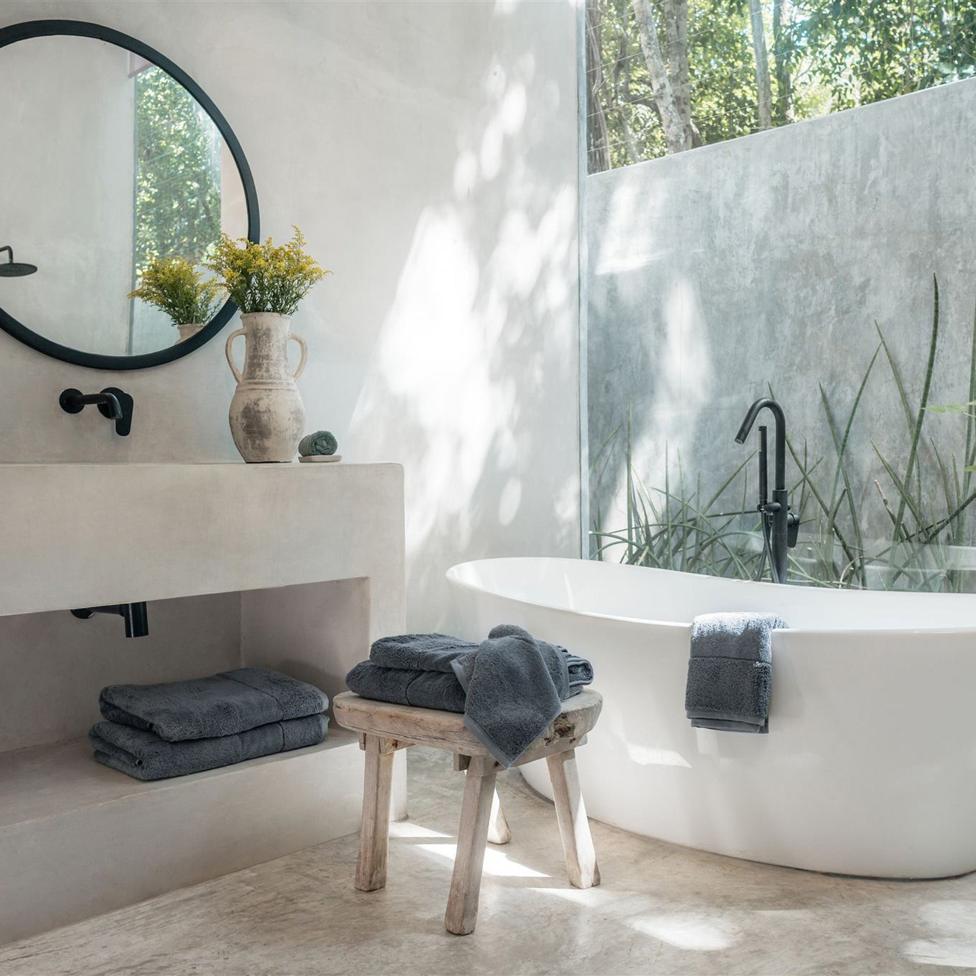 Ritual Bath Towel Set by Rest & Reset styled in a minimalist bathroom, emphasizing simplicity and comfort
