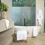 Ritual Bath Towel Set by Rest & Reset styled with natural elements, enhancing a fresh and calming bathroom feel
