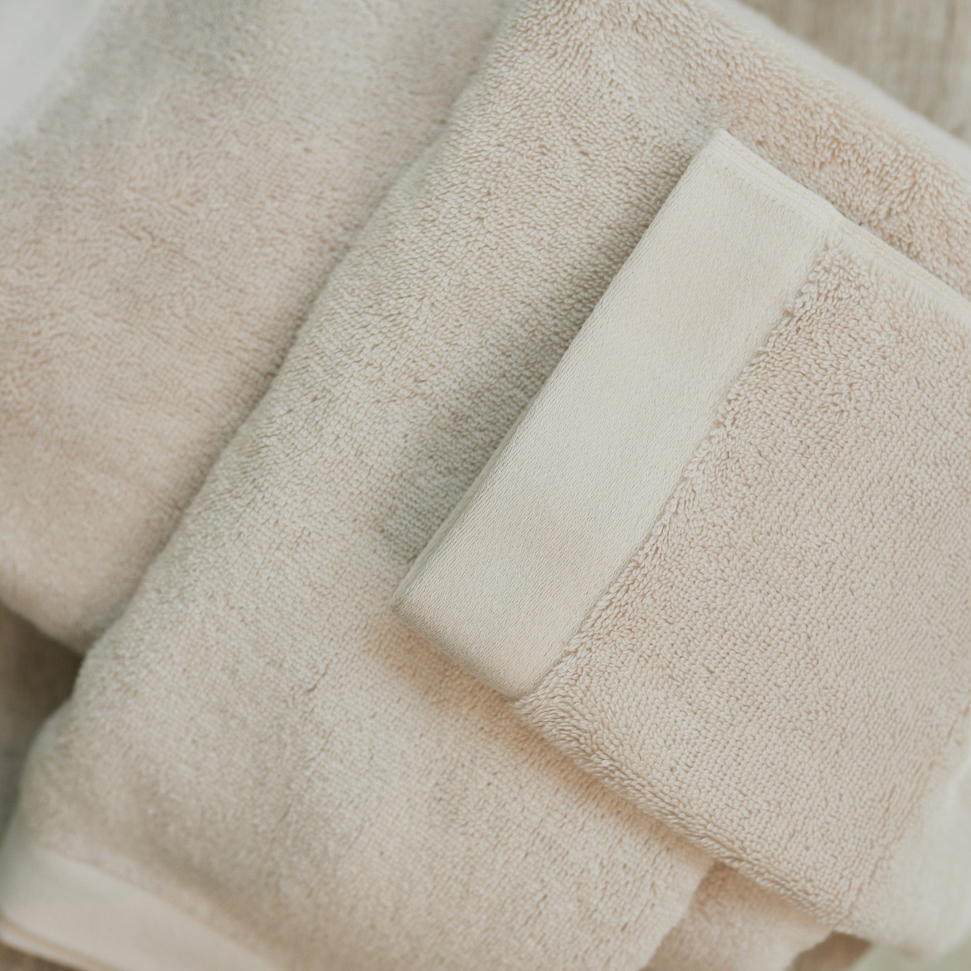 Close-up of towel edge from the Oasis Bath Towel Set by Rest & Reset, showing clean finishing and durability