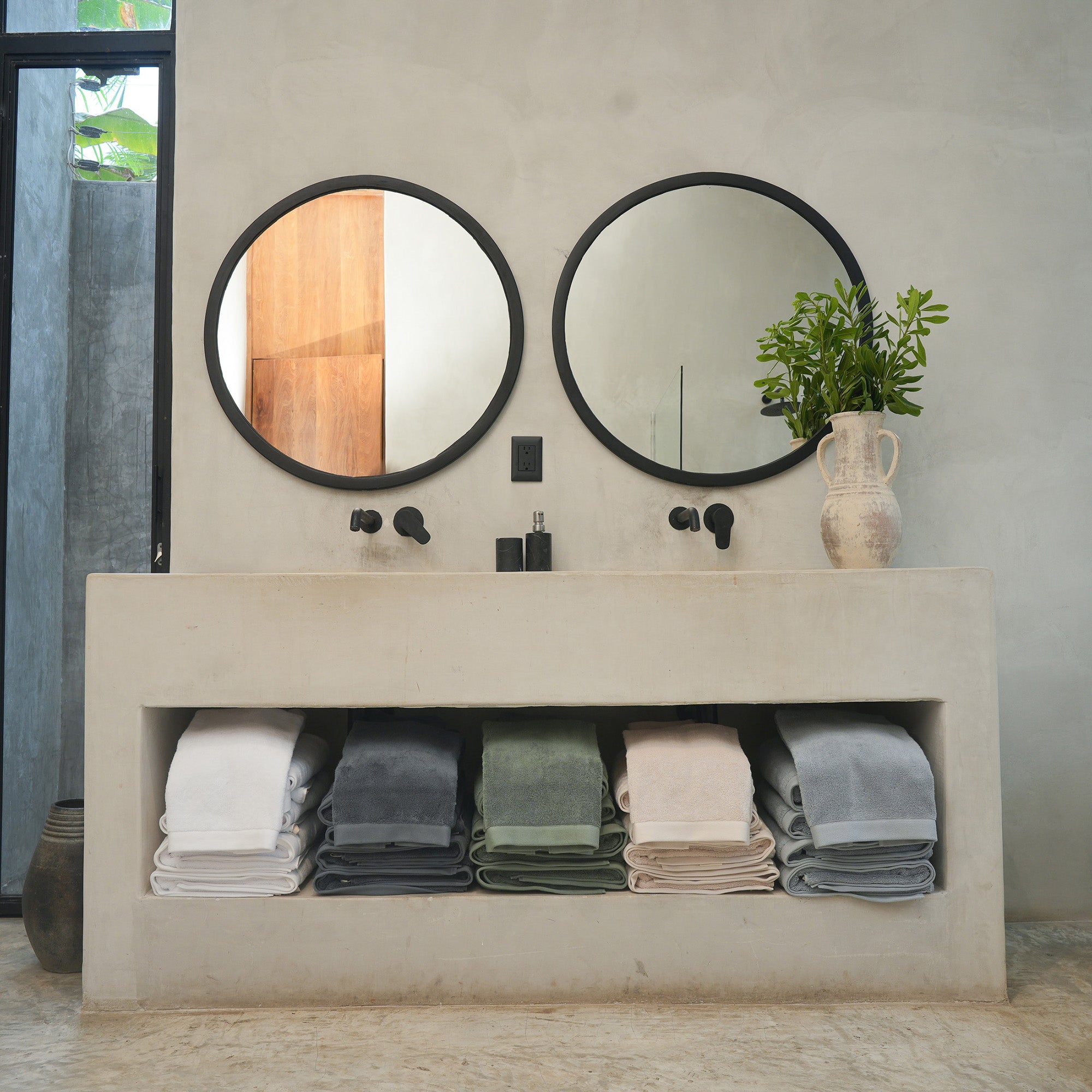 Oasis Bath Towel Set by Rest & Reset styled with coordinated bath decor for a refined and relaxing atmosphere