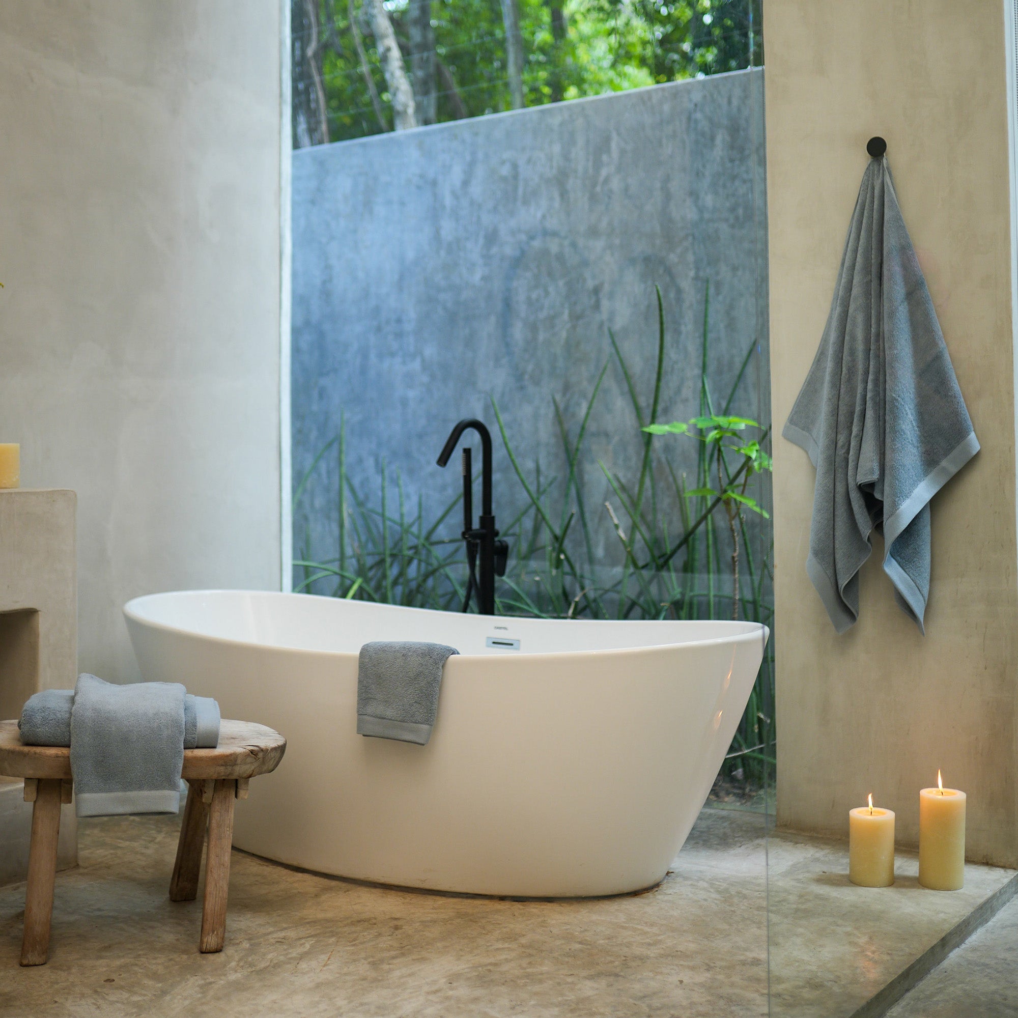 Oasis Bath Towel Set by Rest & Reset styled in a serene bathroom, creating a calm and elevated bathing experience