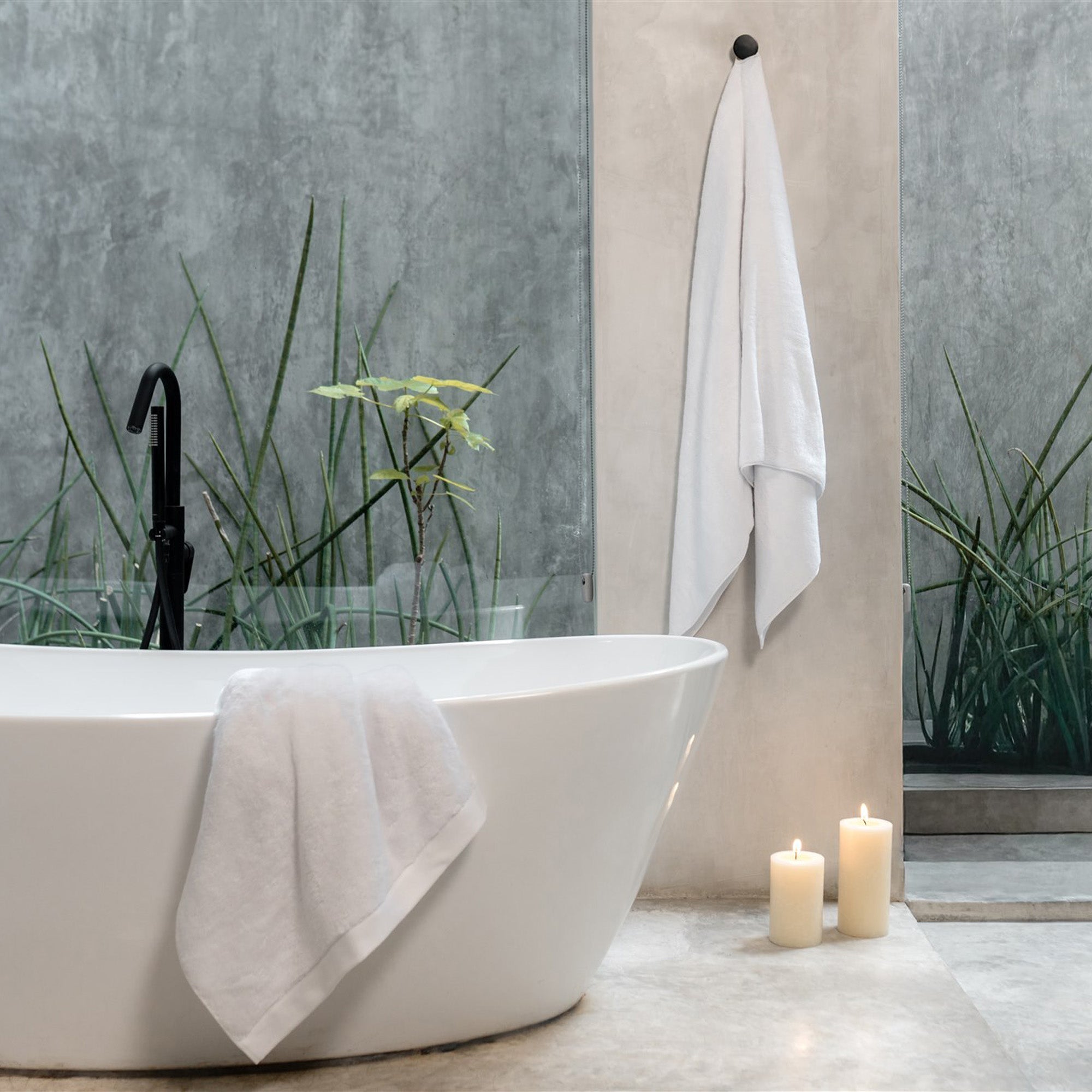 Oasis Bath Towel Set by Rest & Reset styled as part of a complete bathroom setup for everyday luxury