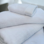 Oasis Bath Towel Set by Rest & Reset folded in a lighter shade, showcasing softness and refined finishing