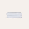 Oasis Bath Towels Pair by Rest & Reset stacked neatly, presenting absorbent towels designed for daily routines