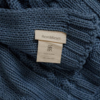 Close-up of label on Drift Throw Blanket by Rest & Reset, emphasizing craftsmanship and premium materials