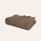 Drift Throw Blanket by Rest & Reset folded in a lighter shade, highlighting softness and relaxed design