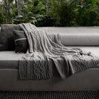 Drift Throw Blanket by Rest & Reset draped in an outdoor setting, designed for relaxed and mindful moments