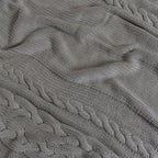 Close-up of organic cotton weave on Drift Throw Blanket by Rest & Reset, highlighting rich texture and softness