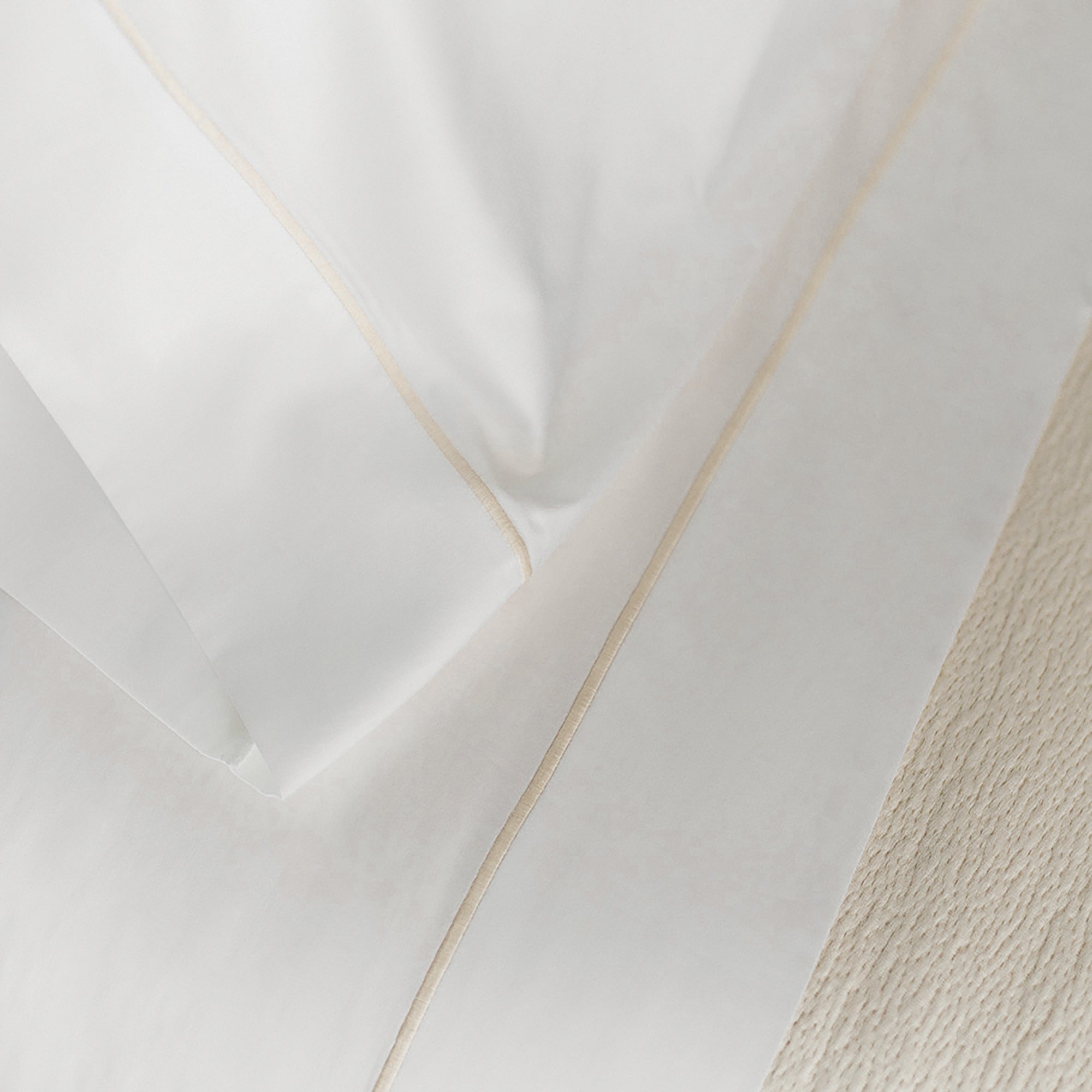 Close-up of organic cotton duvet cover from the Serene Duvet Cover Set by Rest & Reset, highlighting softness and drape