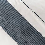 Close-up of organic cotton fabric from the Serene Duvet Cover Set by Rest & Reset, highlighting subtle texture variation